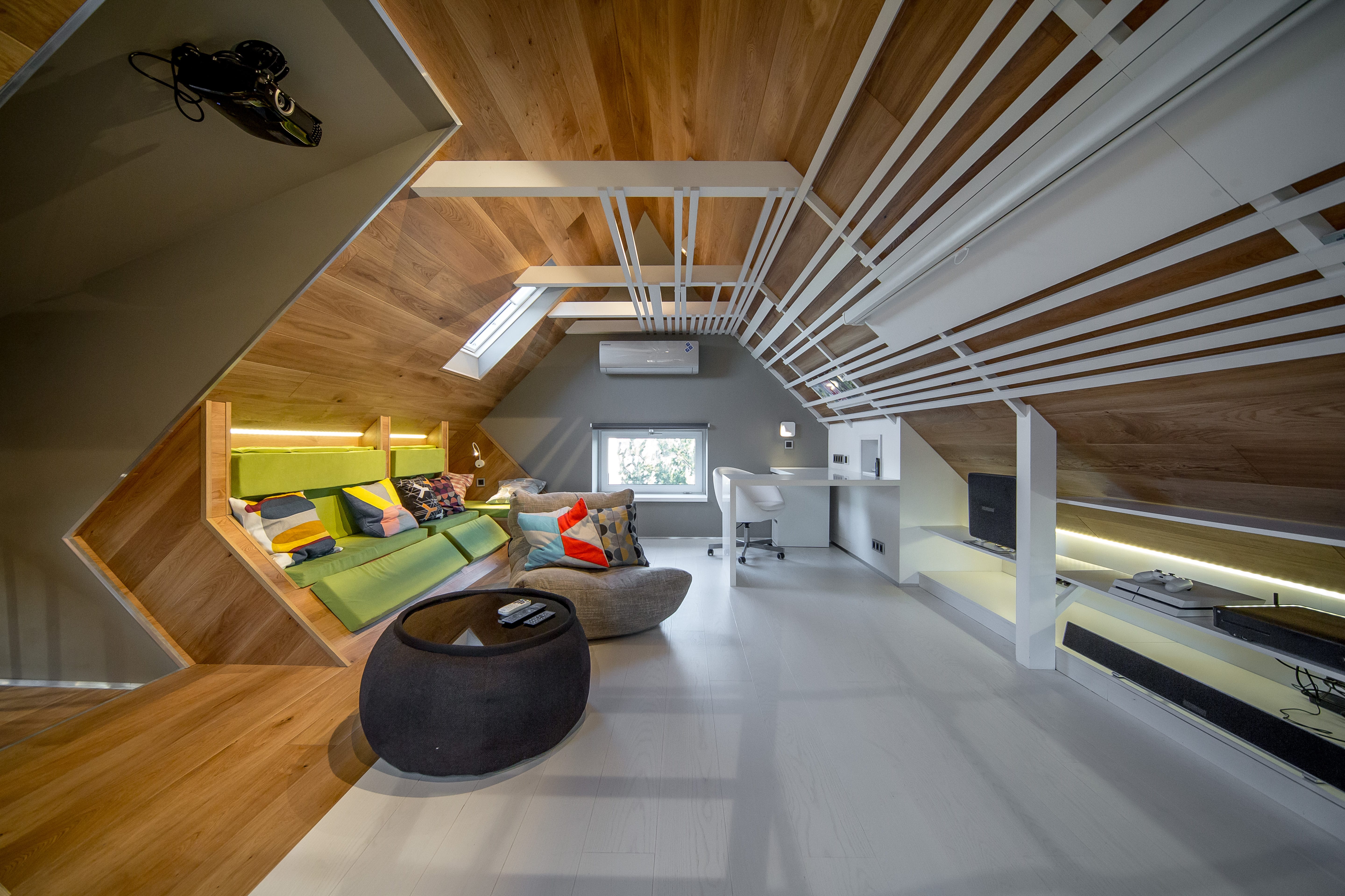 Modern attic with Acoustic Sofa and Versa Table bean bags.