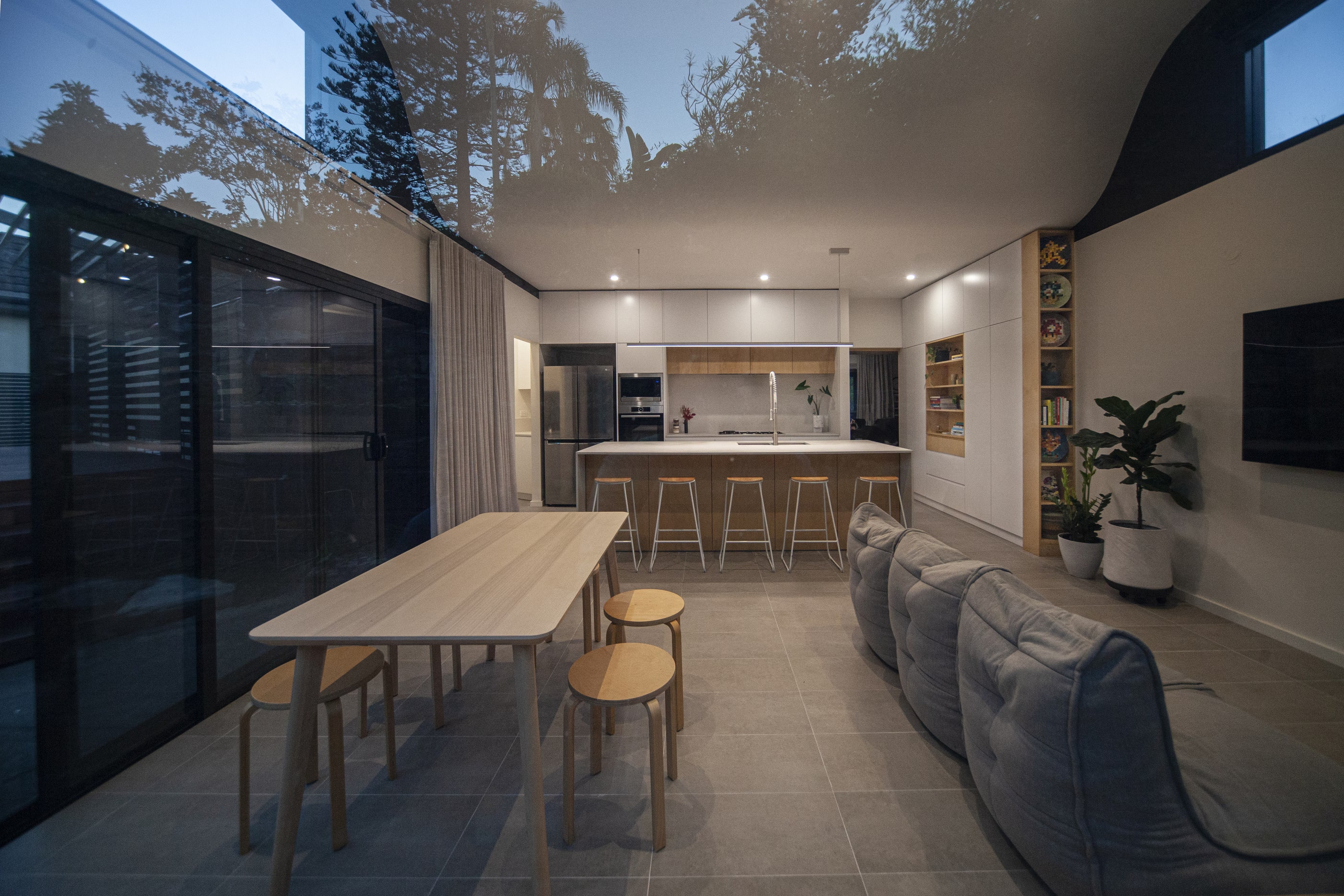 Modern open-plan living, dining and kitchen space with Modular Sofa bean bags.