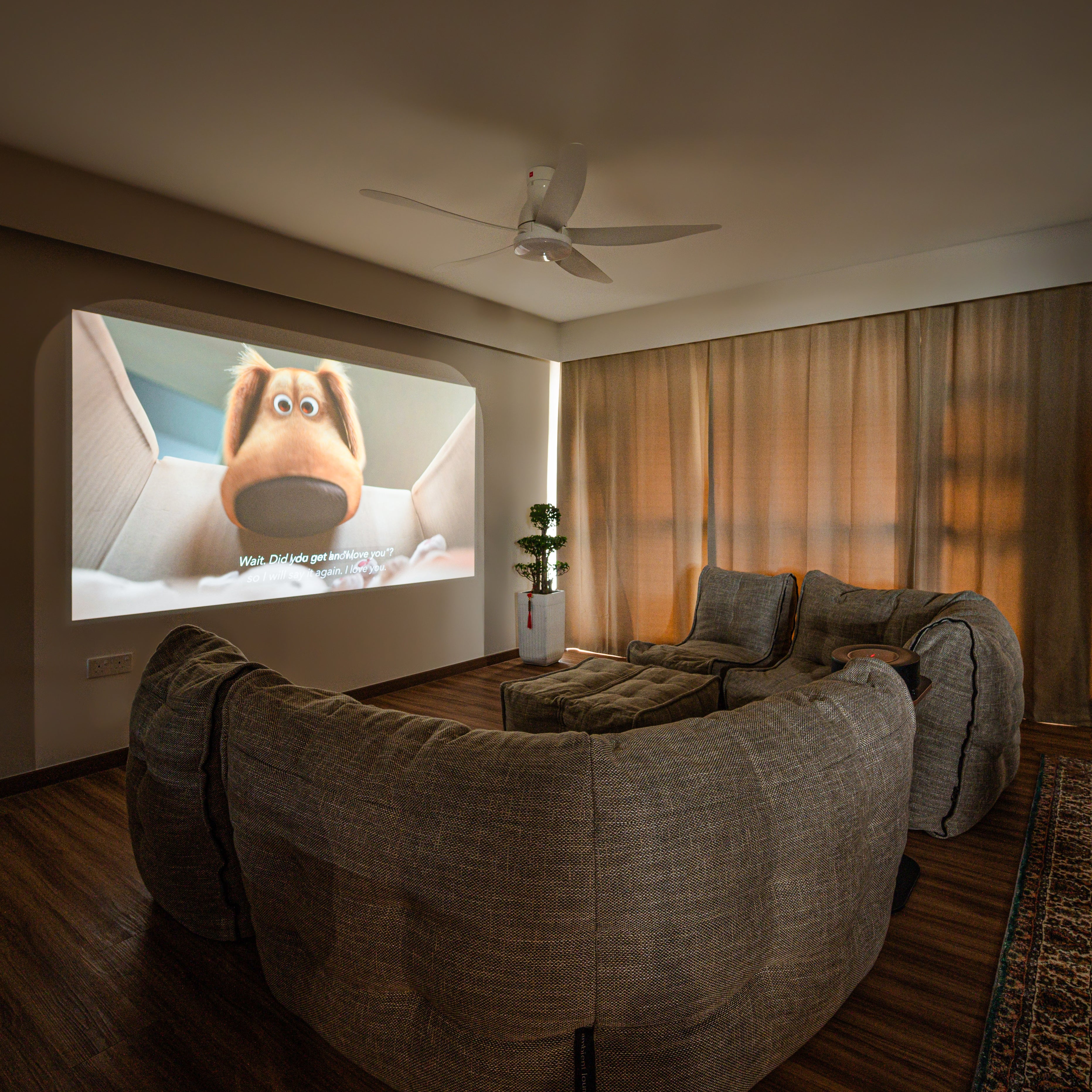 Living room home theatre with beige Modular bean bag sofa.