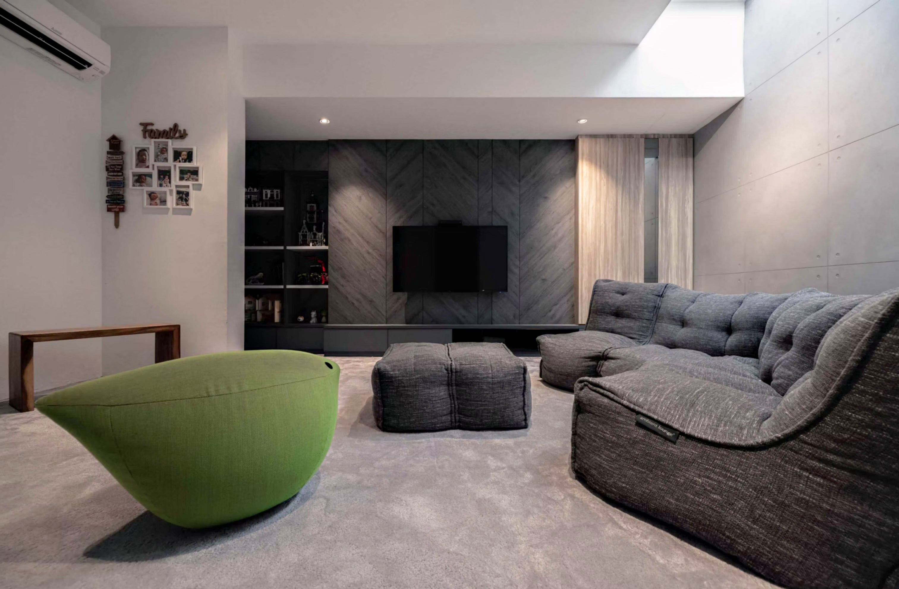 Modular Sofa bean bags in Luscious Grey in a modern basement entertainment room with wall-mounted TV.