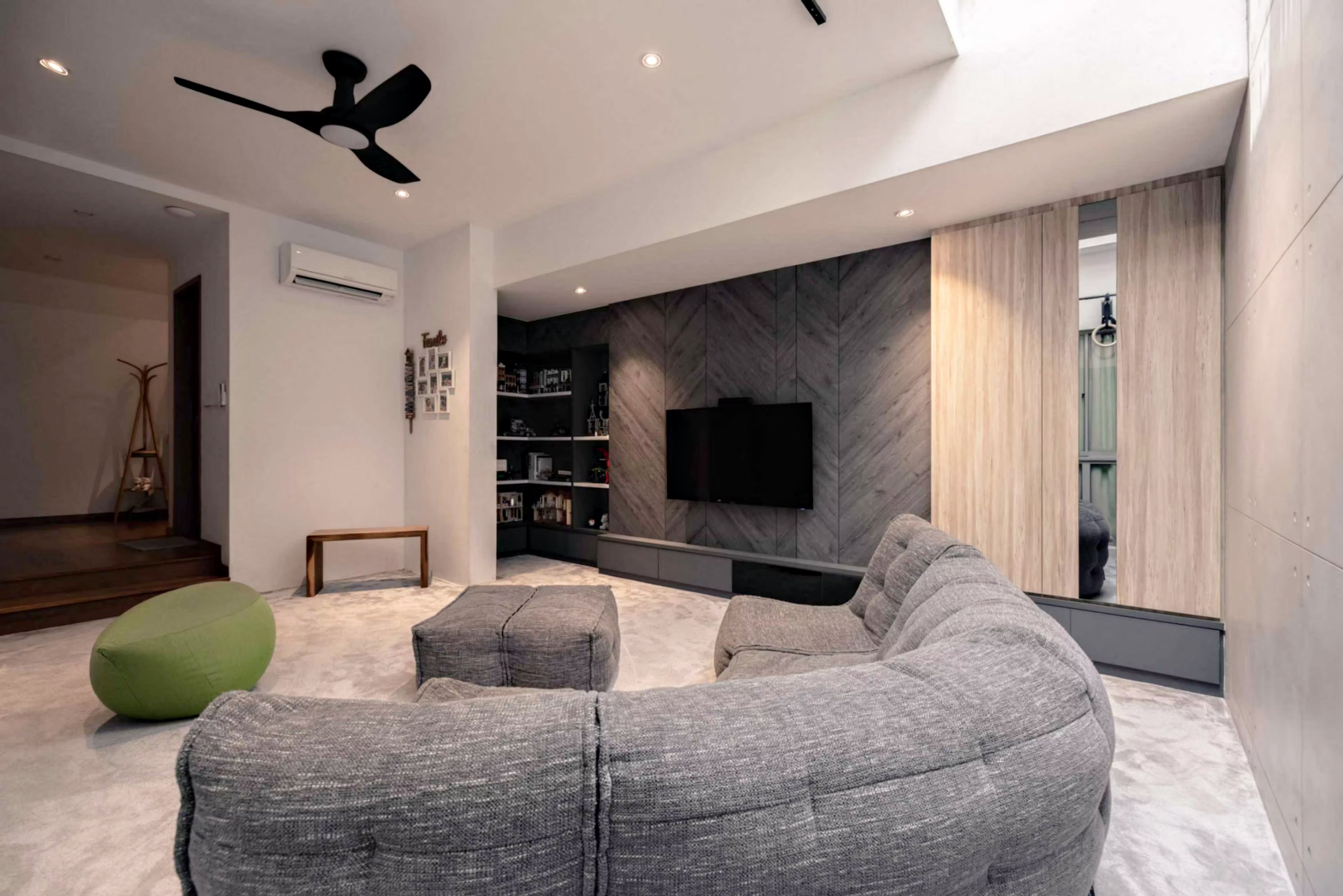 Natural light fills a sleek, modern basement with Modular Sofa bean bags in Luscious Grey.