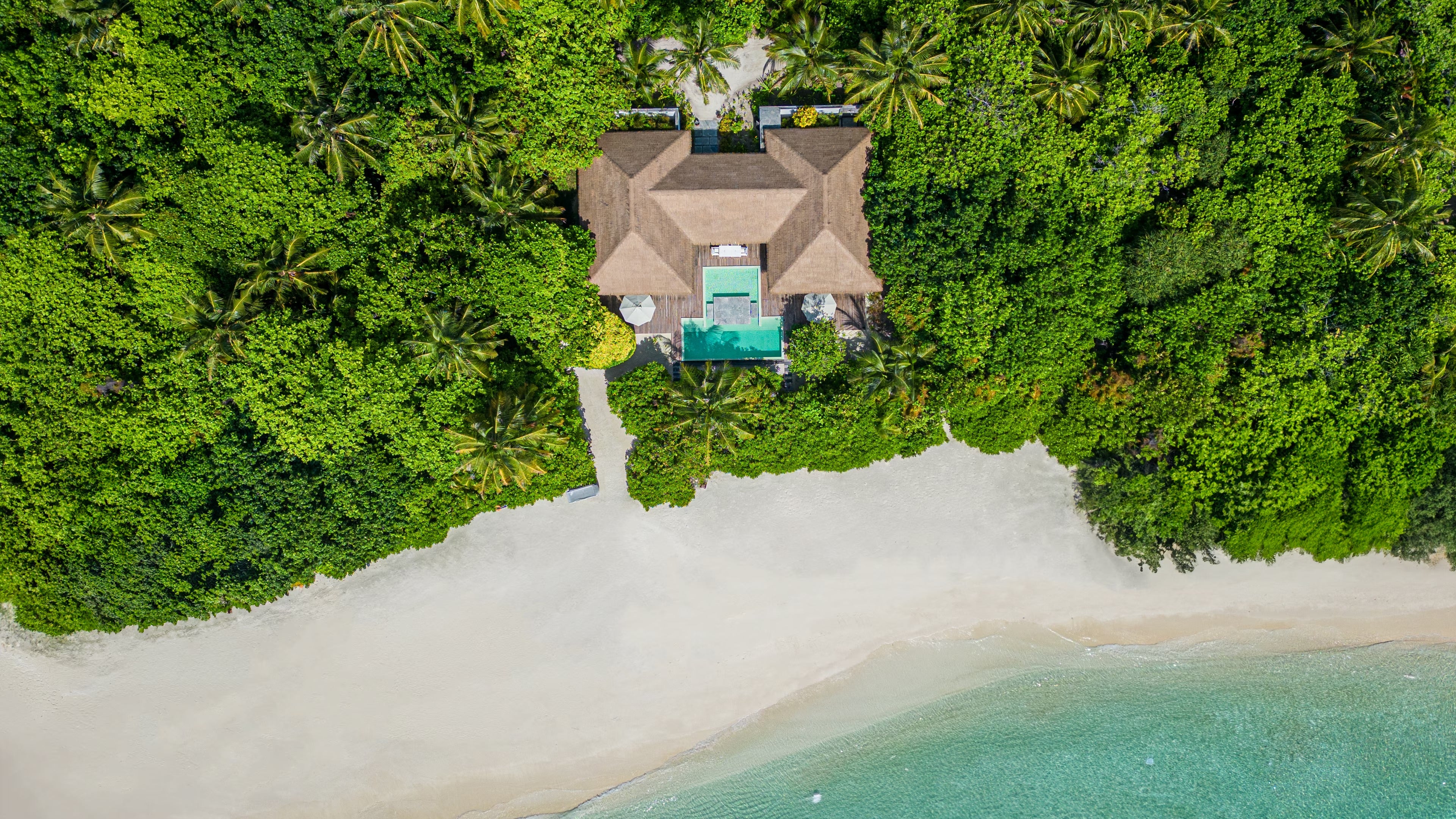 Aerial view of 2-Bedroom Beachfront Pool Villa at Noku Maldives Resort.
