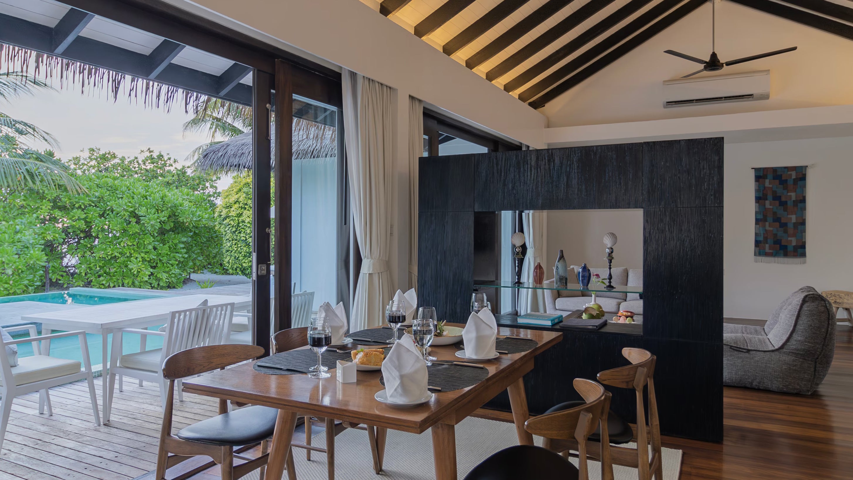 Twin Couch bean bag in living room of 2-Bedroom Beachfront Pool Villa as seen from dining area.